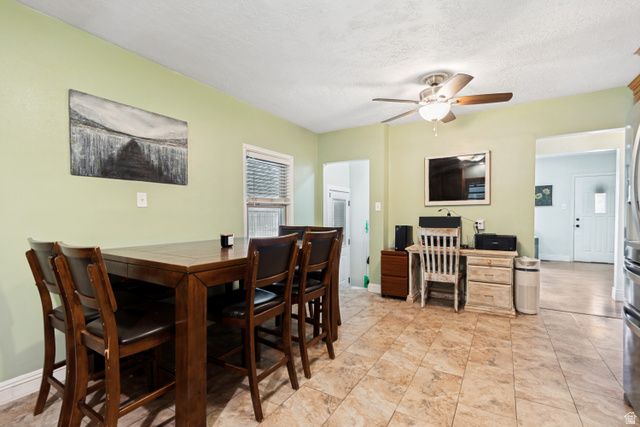 127 West 300 North Springville, UT 84663 - Photo 10 of 24 Spacious dining area featuring neutral tile flooring, light green wall paint, a ceiling fan with integrated lighting, and a white framed window with horizontal blinds