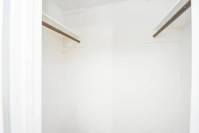 a white toilet sitting next to a bath tub