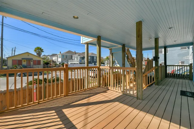 a view of a balcony with wooden floor