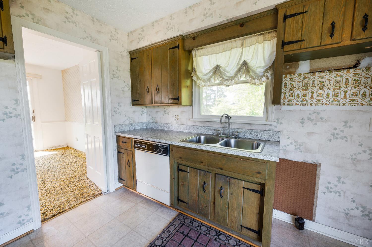 1250 Lick Run Farm Road Forest, VA 24551 - Photo 12 of 74 a kitchen with stainless steel appliances granite countertop a sink stove and cabinets
