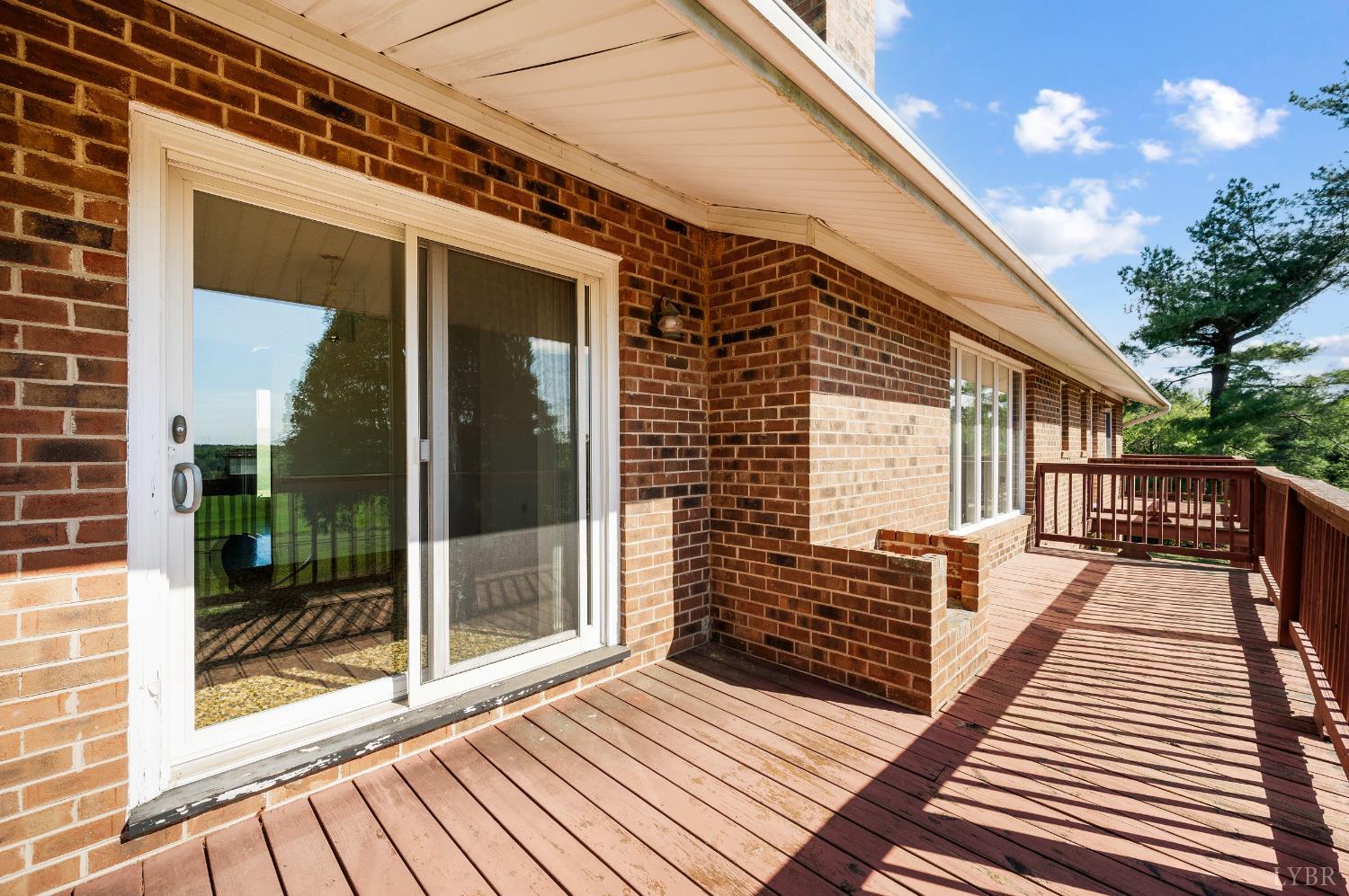 1250 Lick Run Farm Road Forest, VA 24551 - Photo 16 of 74 a view of balcony with wooden floor and floor to ceiling window