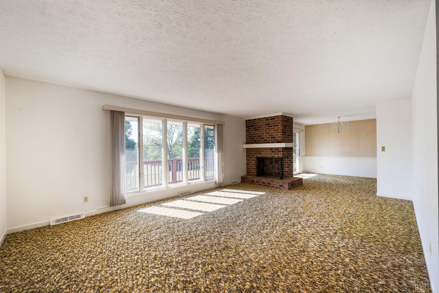 1250 Lick Run Farm Road Forest, VA 24551 - Photo 19 of 74 a view of an empty room with a fireplace and a window