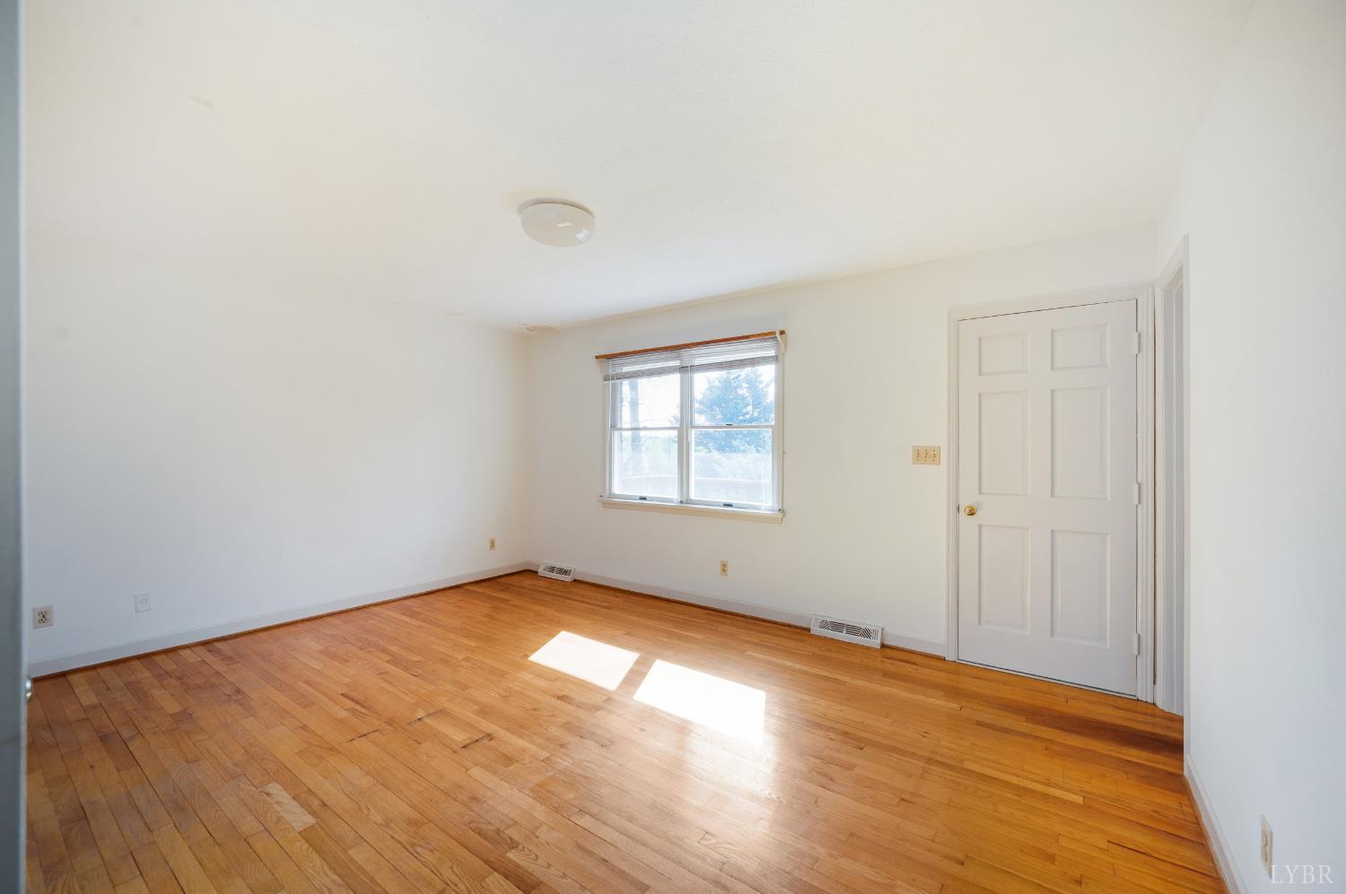 1250 Lick Run Farm Road Forest, VA 24551 - Photo 21 of 74 an empty room with wooden floor and windows