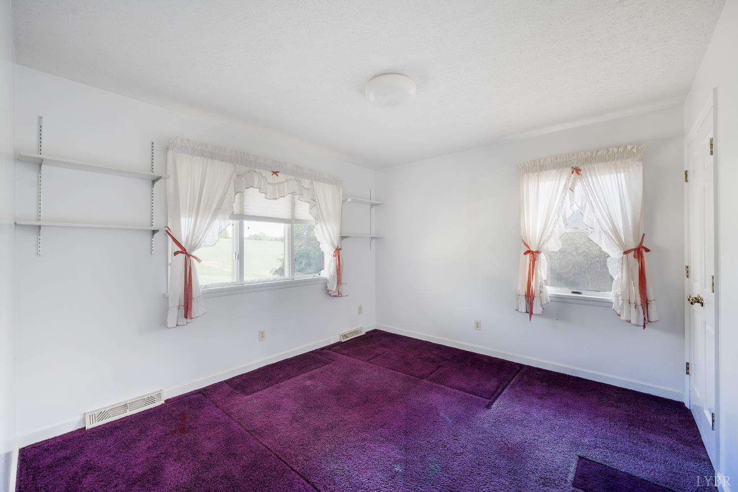 1250 Lick Run Farm Road Forest, VA 24551 - Photo 27 of 74 a view of empty room with wooden floor and fan