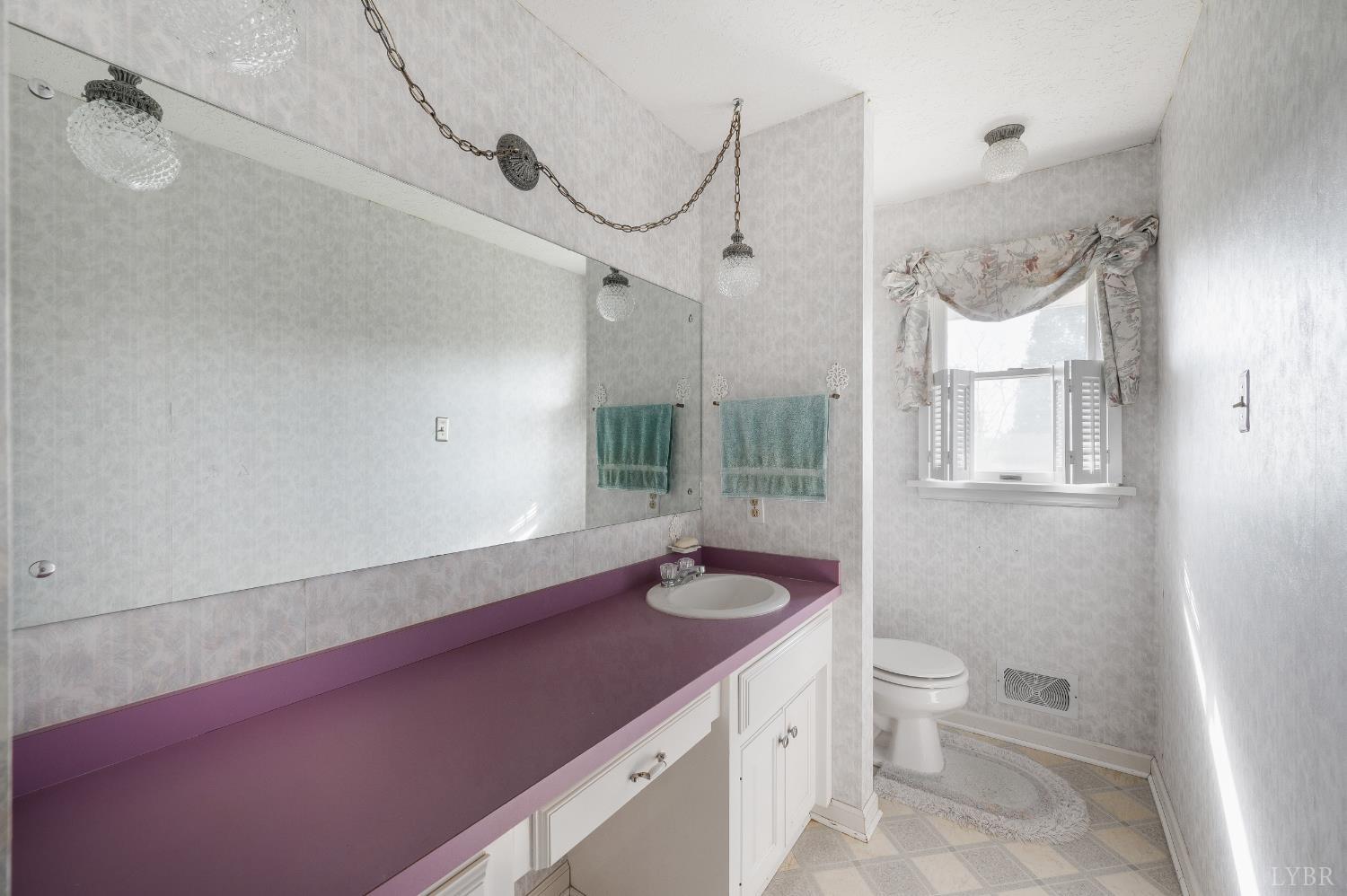 1250 Lick Run Farm Road Forest, VA 24551 - Photo 33 of 74 a bathroom with a granite countertop sink and a mirror