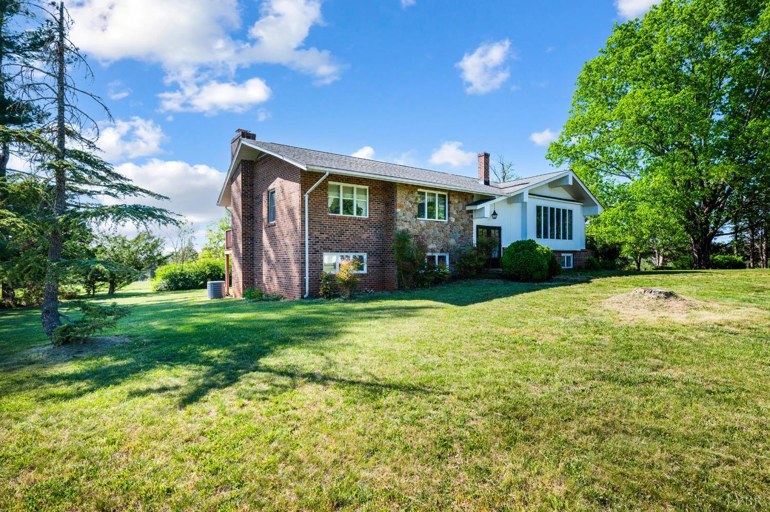 1250 Lick Run Farm Road Forest, VA 24551 - Photo 47 of 74 a view of a house with a backyard