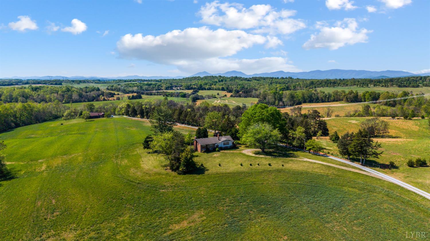 1250 Lick Run Farm Road Forest, VA 24551 - Photo 60 of 74 a view of a lake with houses in the back