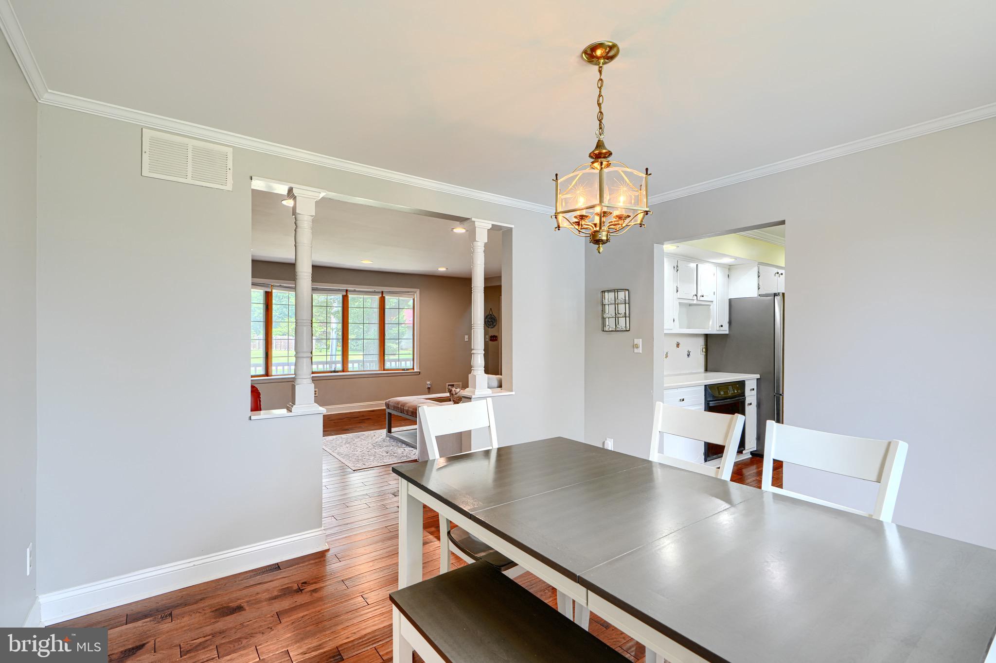 4225 Chapel Road Perry Hall, MD 21128 - Photo 13 of 65 a view of a dining room with furniture and wooden floor