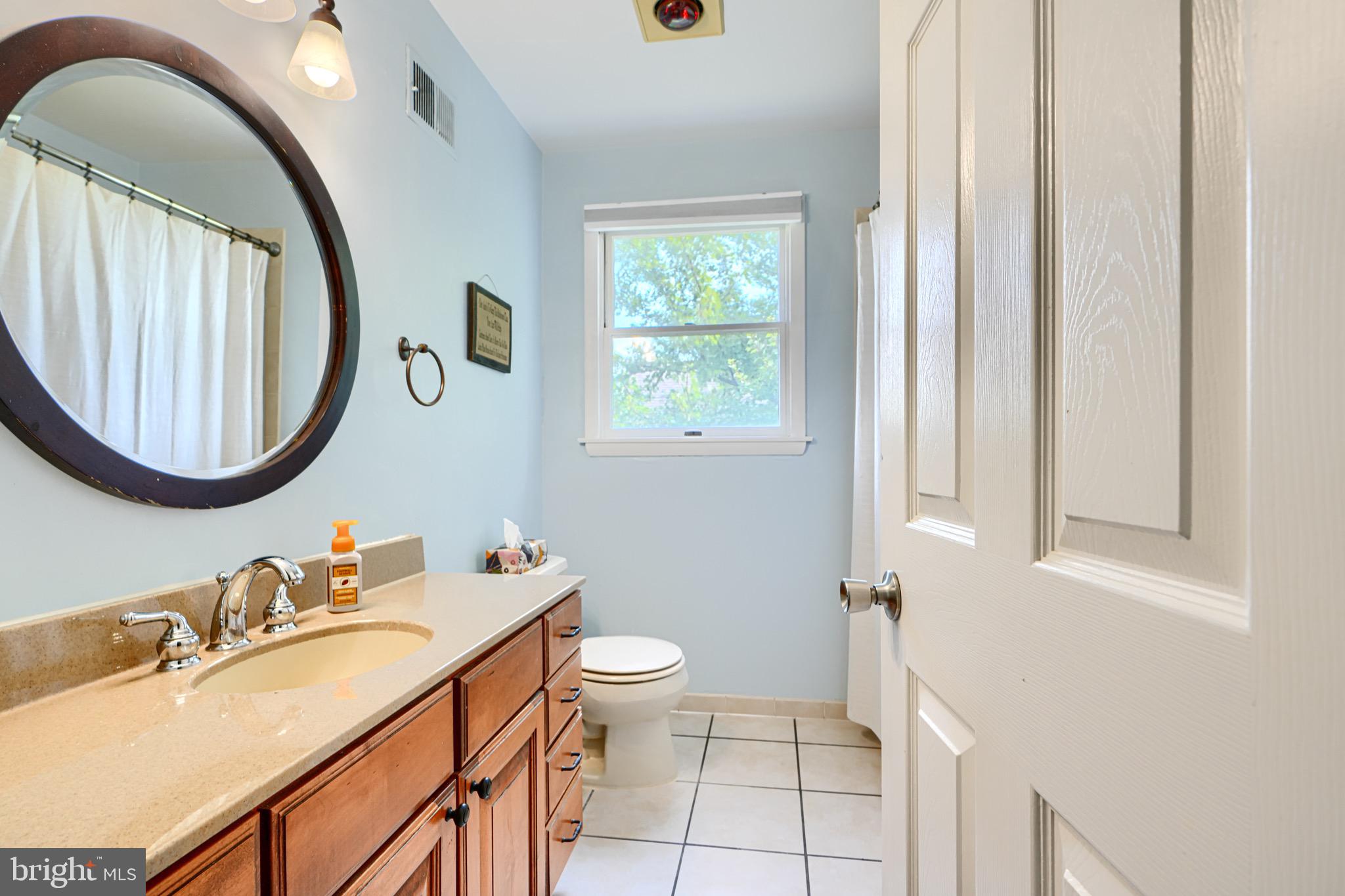 4225 Chapel Road Perry Hall, MD 21128 - Photo 29 of 65 a bathroom with a sink and a mirror