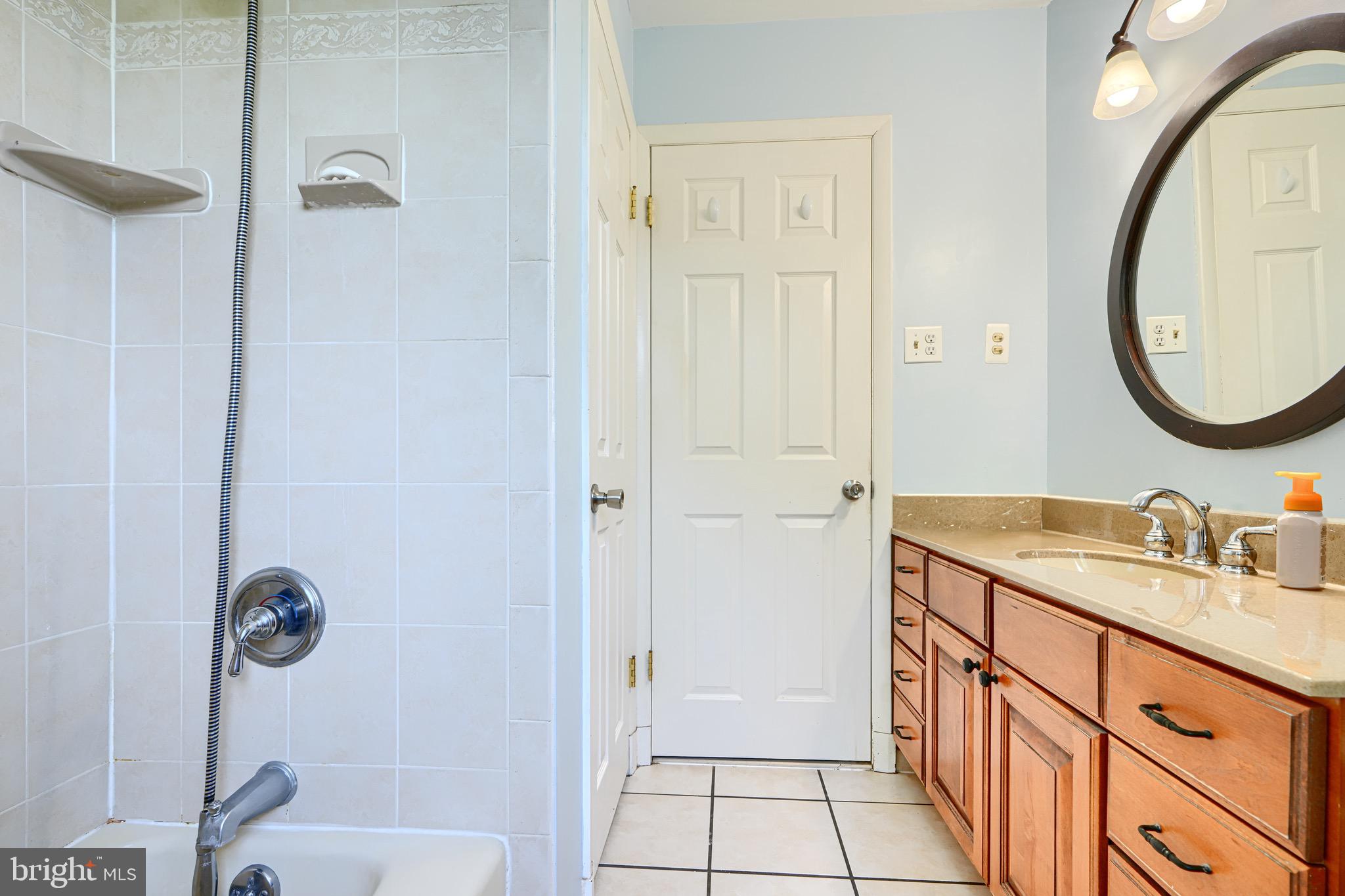 4225 Chapel Road Perry Hall, MD 21128 - Photo 30 of 65 a bathroom with a sink a toilet and a mirror