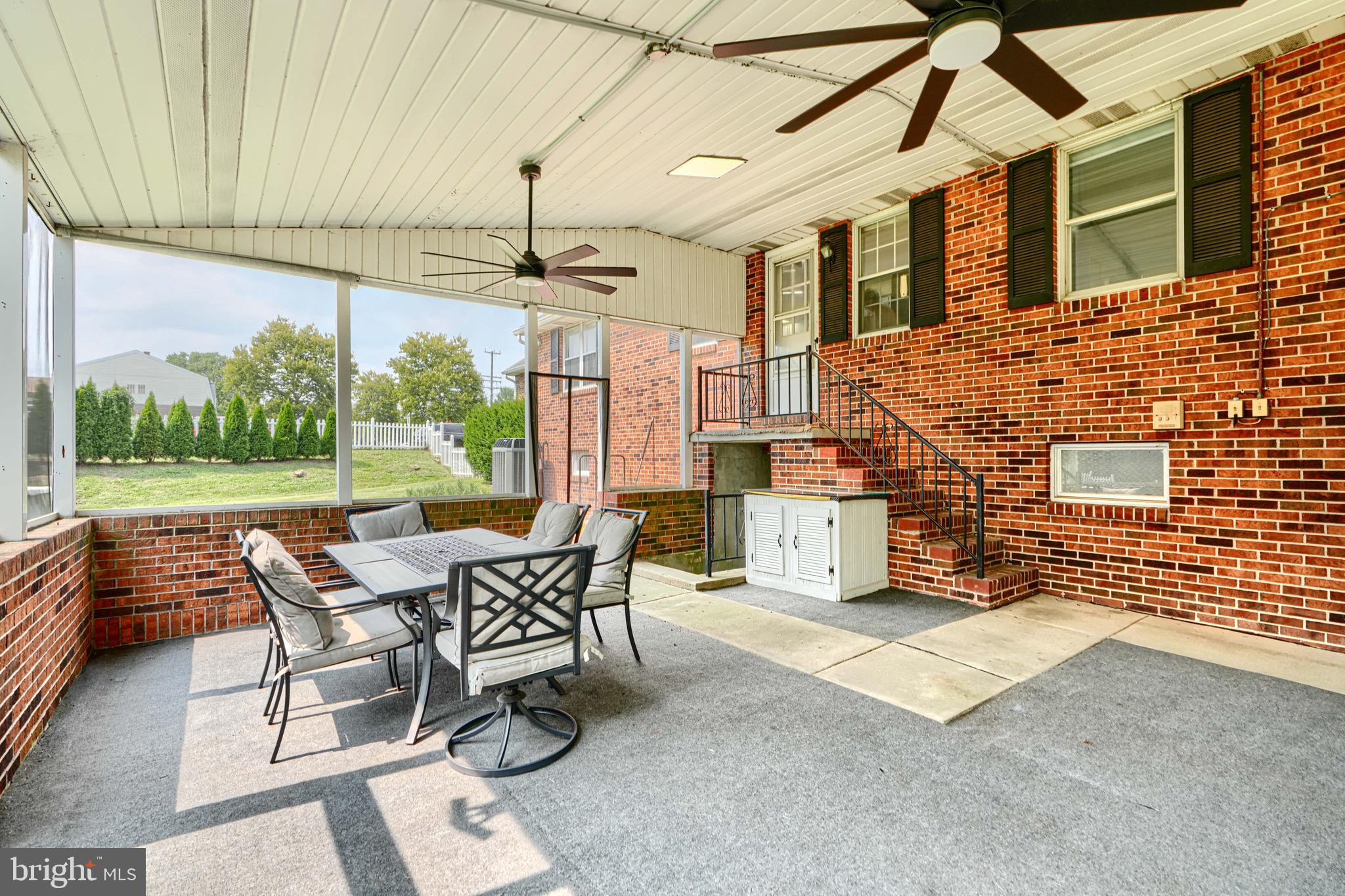 4225 Chapel Road Perry Hall, MD 21128 - Photo 33 of 65 a view of a patio with a table and chairs