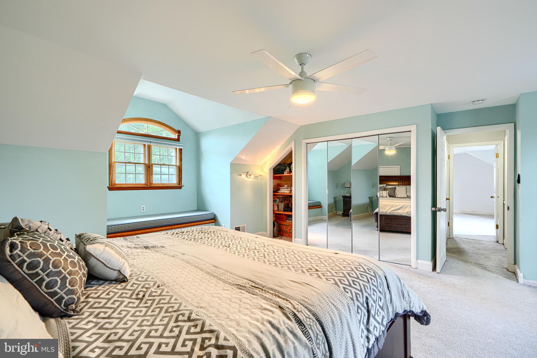 4225 Chapel Road Perry Hall, MD 21128 - Photo 38 of 65 a bedroom with a large bed and a chandelier