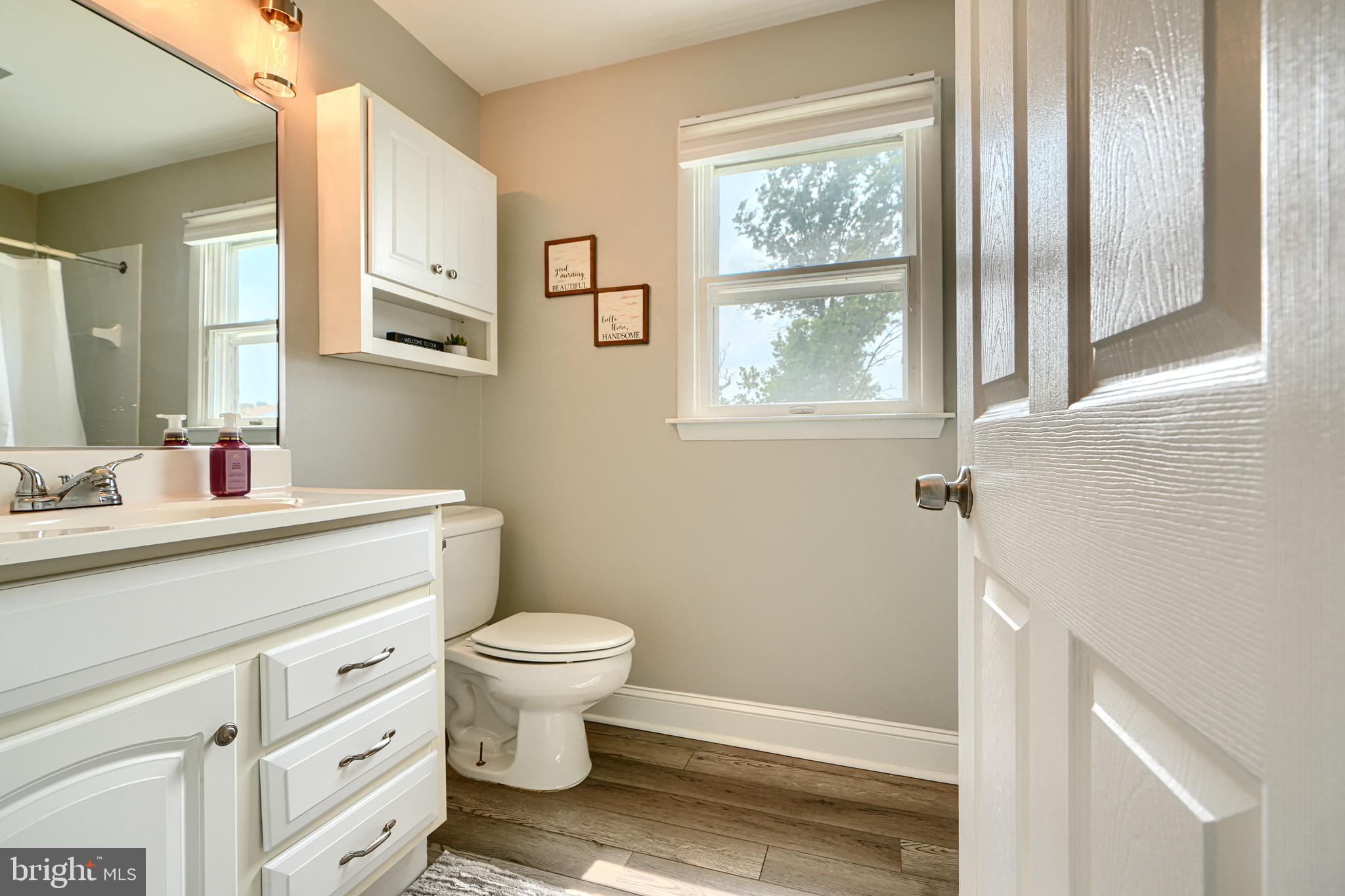 4225 Chapel Road Perry Hall, MD 21128 - Photo 40 of 65 a bathroom with a sink a toilet and a window