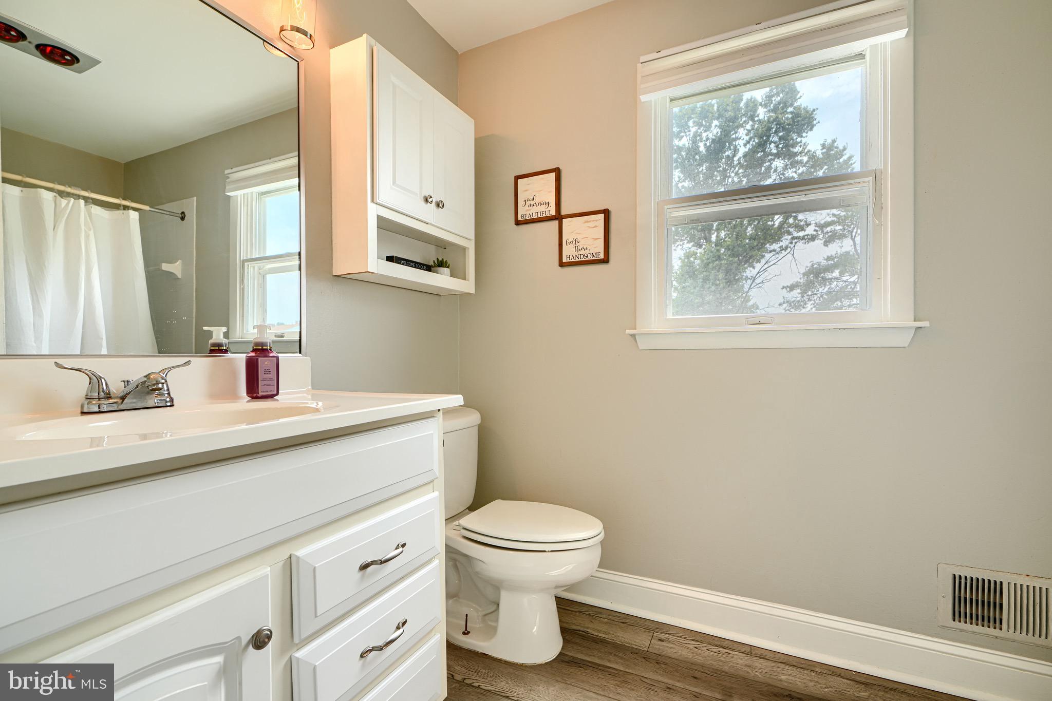 4225 Chapel Road Perry Hall, MD 21128 - Photo 41 of 65 a bathroom with a sink a toilet and a window
