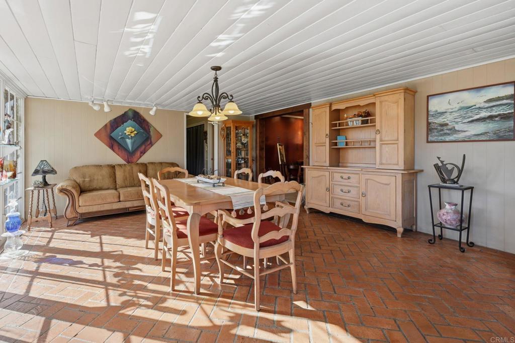 145 Barhaven Lane Fallbrook, CA 92028 - Photo 18 of 46 a view of a dining room with furniture and chandelier