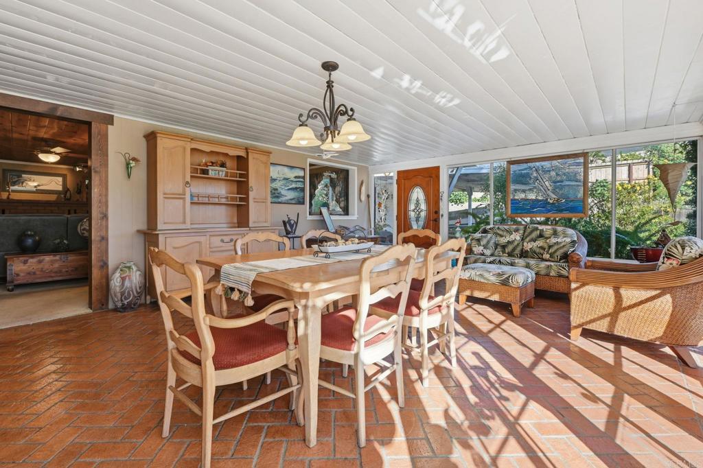 145 Barhaven Lane Fallbrook, CA 92028 - Photo 19 of 46 a view of a dining room with furniture wooden floor and chandelier