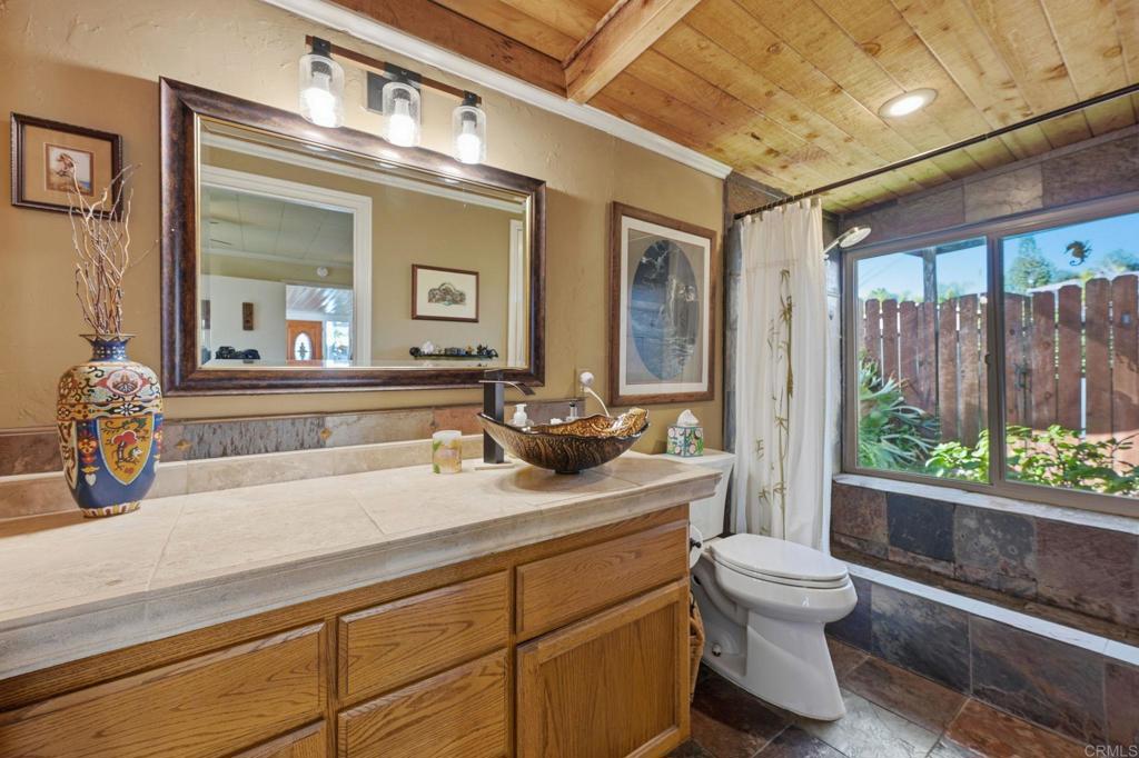 145 Barhaven Lane Fallbrook, CA 92028 - Photo 24 of 46 a bathroom with a toilet sink and mirror