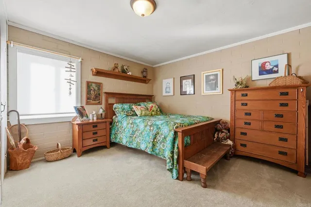 a bedroom with a bed and a cabinets