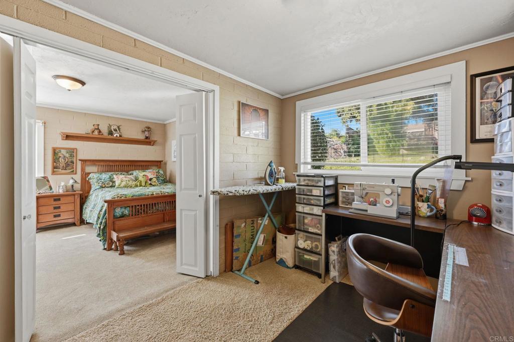 145 Barhaven Lane Fallbrook, CA 92028 - Photo 31 of 46 a bedroom with furniture and a large window