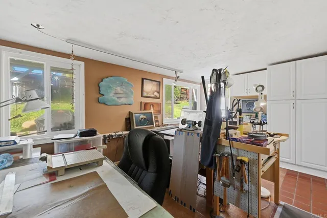 a view of a pathway with a backyard of house