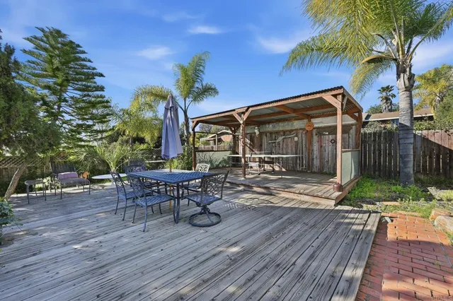 a front view of a house with garden and patio
