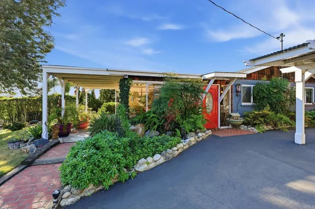 a view of a porch with potted plants