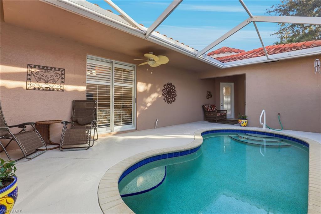1769 Sanctuary Pointe Court Naples, FL 34110 - Photo 19 of 40 a indoor swimming pool with barbeque oven