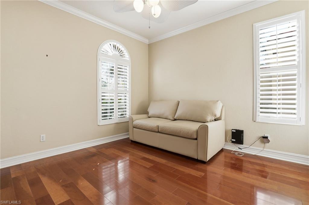 1769 Sanctuary Pointe Court Naples, FL 34110 - Photo 22 of 40 a living room with furniture and a window