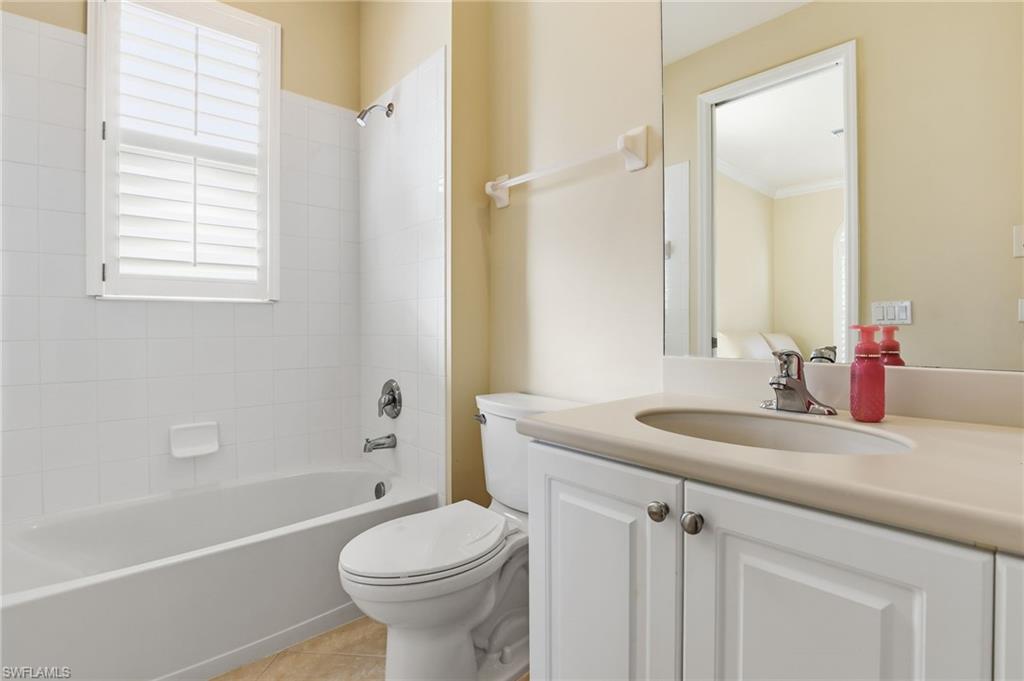 1769 Sanctuary Pointe Court Naples, FL 34110 - Photo 24 of 40 a bathroom with a sink toilet vanity and tub