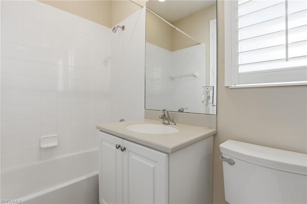 1769 Sanctuary Pointe Court Naples, FL 34110 - Photo 25 of 40 a bathroom with a sink a toilet and a bathtub