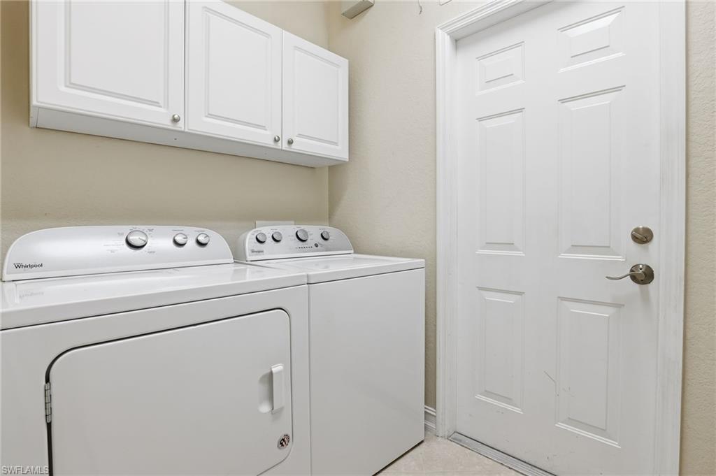 1769 Sanctuary Pointe Court Naples, FL 34110 - Photo 26 of 40 a utility room with dryer and washer