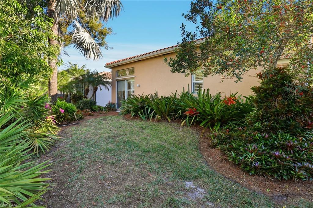 1769 Sanctuary Pointe Court Naples, FL 34110 - Photo 27 of 40 a view of a backyard
