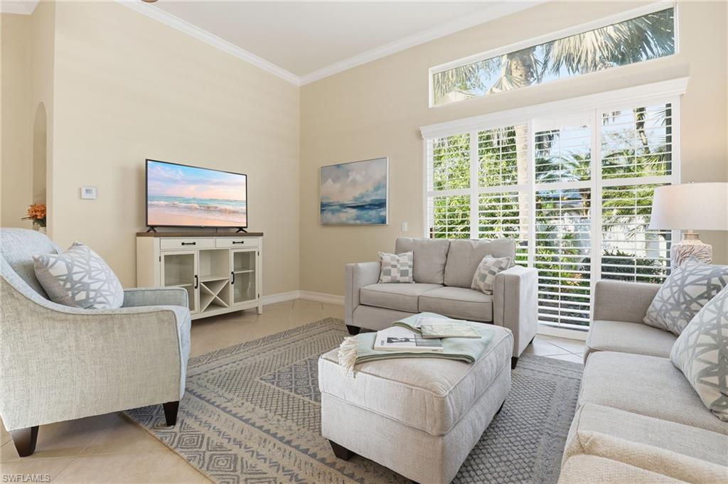 1769 Sanctuary Pointe Court Naples, FL 34110 - Photo 3 of 40 a living room with furniture and a large window