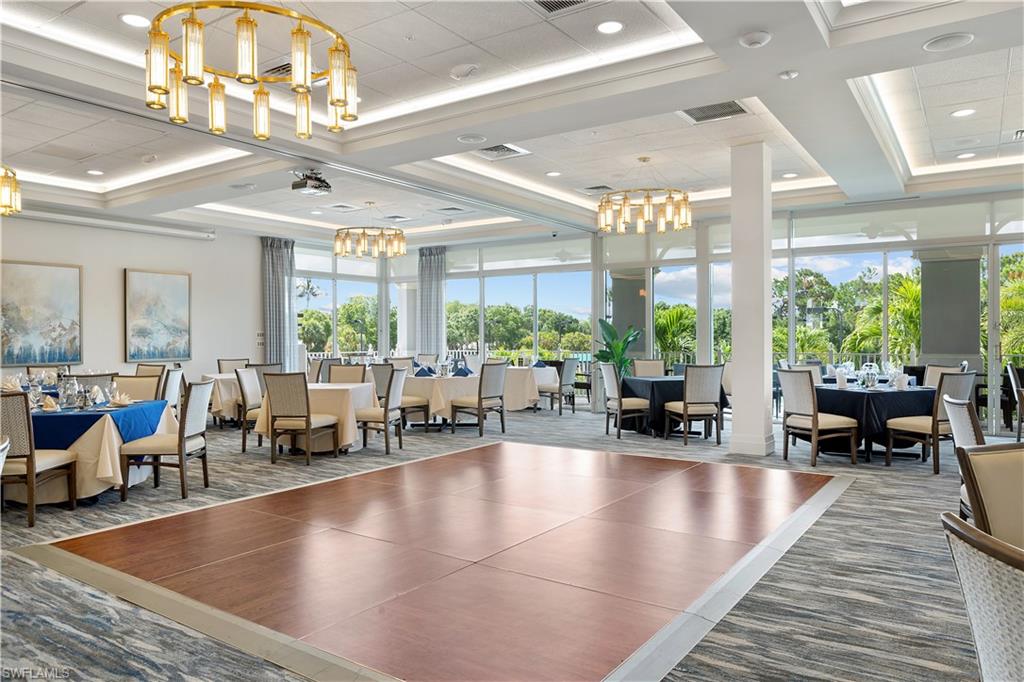 1769 Sanctuary Pointe Court Naples, FL 34110 - Photo 37 of 40 a living room with furniture and large windows