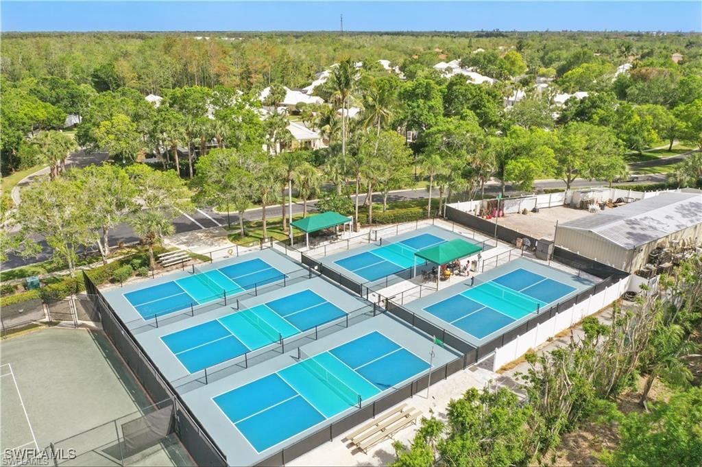 1769 Sanctuary Pointe Court Naples, FL 34110 - Photo 40 of 40 a view of a balcony with chairs and a table