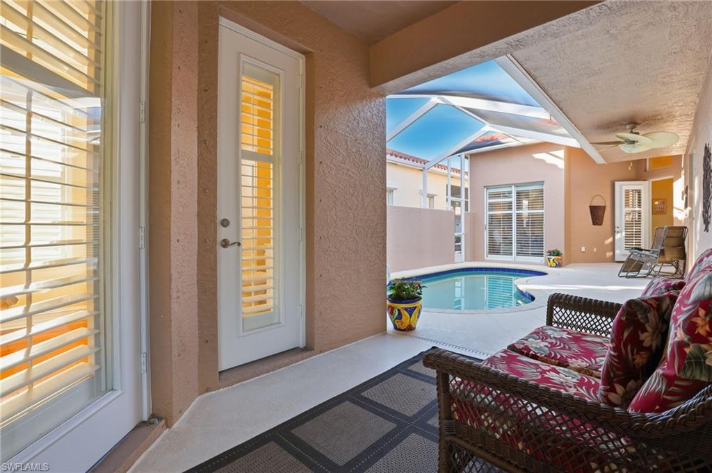 1769 Sanctuary Pointe Court Naples, FL 34110 - Photo 4 of 40 a living room with furniture and a window