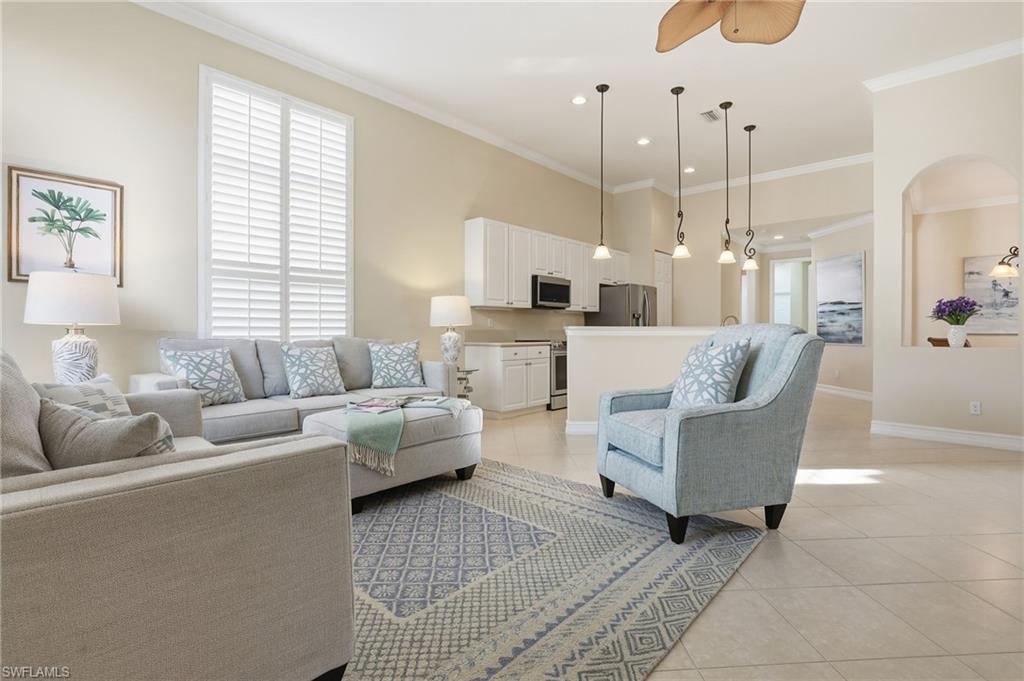 1769 Sanctuary Pointe Court Naples, FL 34110 - Photo 6 of 40 a living room with furniture and a large window