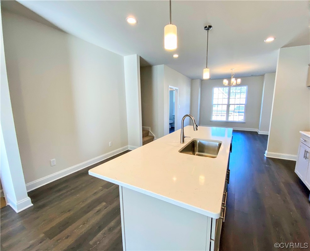 7001 Dunton Road Chesterfield, VA 23832 - Photo 13 of 28 a view of a kitchen with a sink and wooden floor