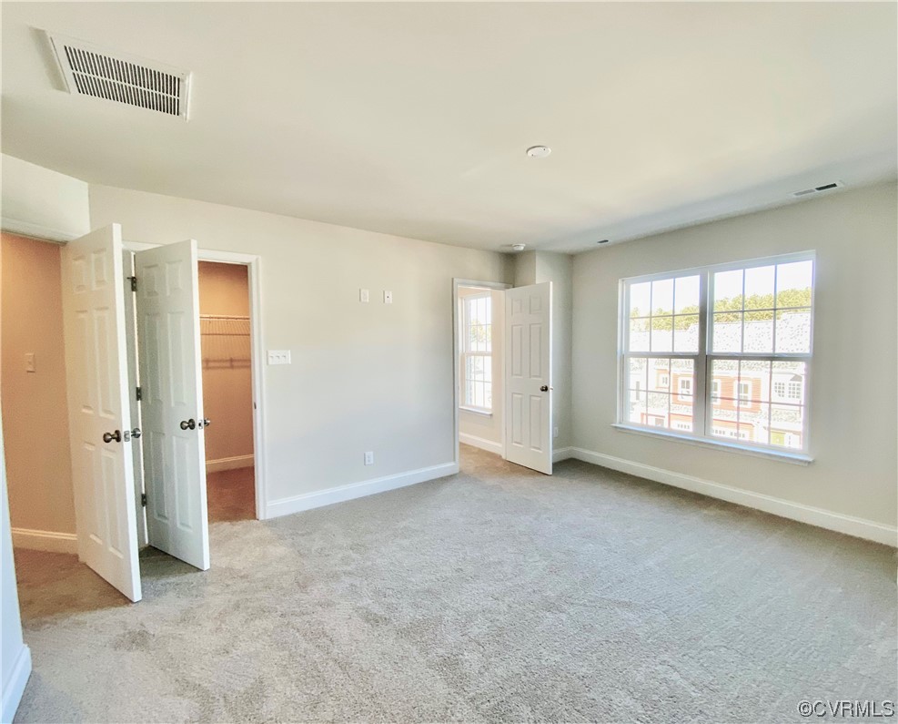 7001 Dunton Road Chesterfield, VA 23832 - Photo 15 of 28 an empty room with windows and closet