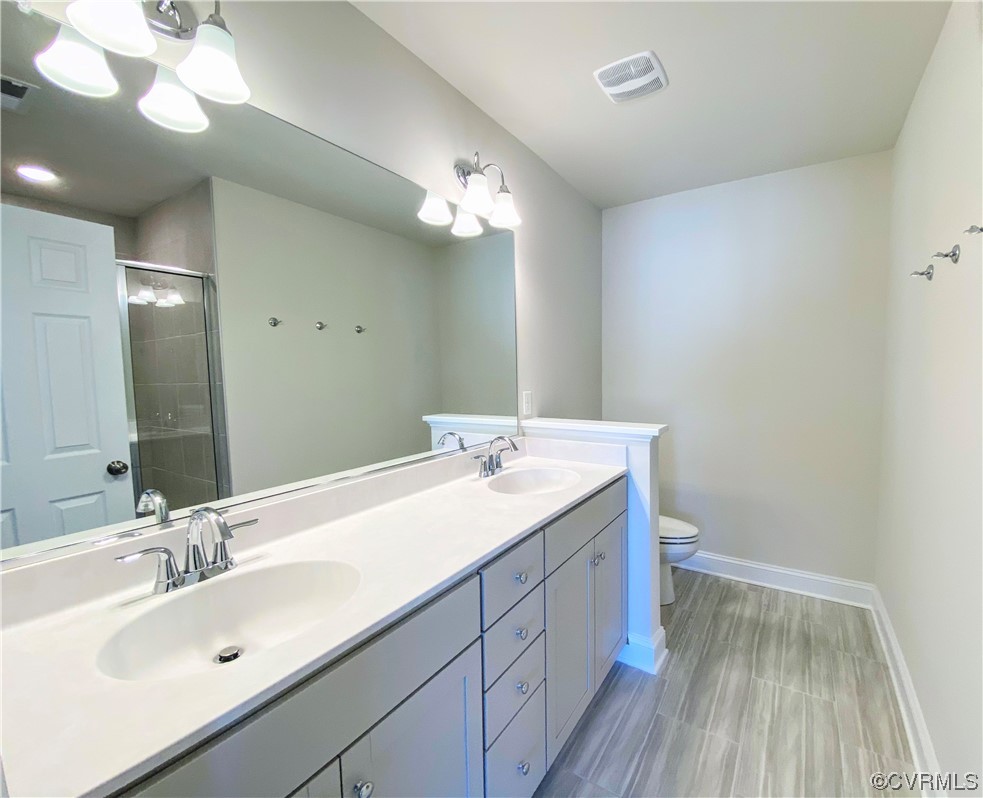7001 Dunton Road Chesterfield, VA 23832 - Photo 18 of 28 a bathroom with a sink and a mirror