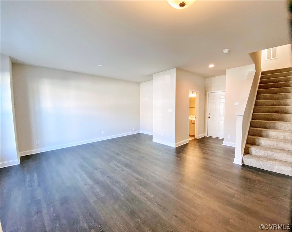 7001 Dunton Road Chesterfield, VA 23832 - Photo 2 of 28 a view of an empty room with wooden floor and stairs