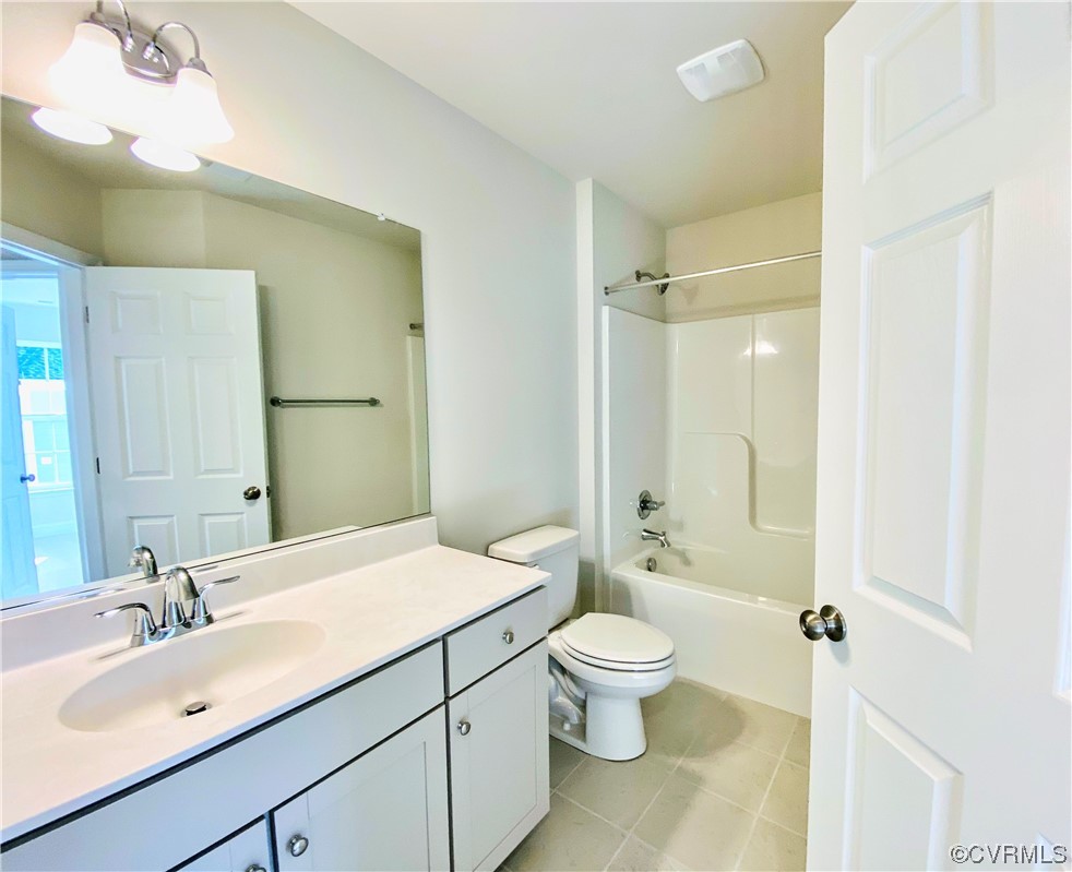 7001 Dunton Road Chesterfield, VA 23832 - Photo 25 of 28 a bathroom with a sink a toilet and shower