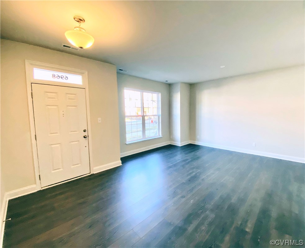 7001 Dunton Road Chesterfield, VA 23832 - Photo 3 of 28 an empty room with wooden floor and windows