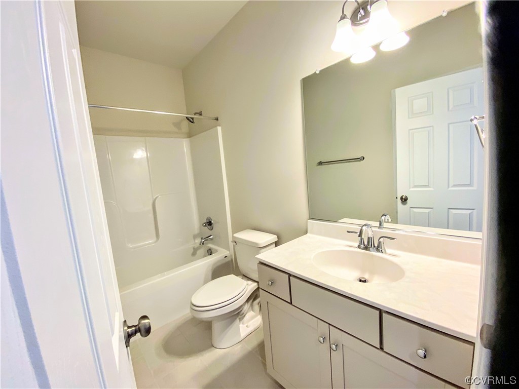 7001 Dunton Road Chesterfield, VA 23832 - Photo 4 of 28 a bathroom with a sink a toilet and shower