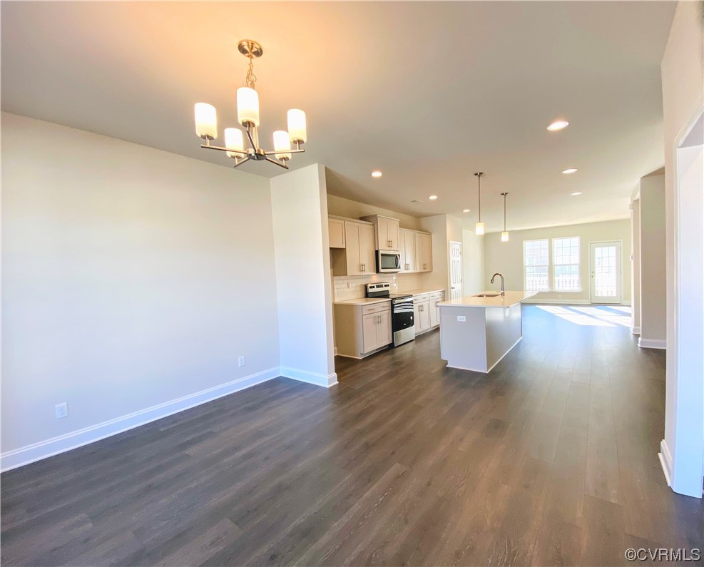 7001 Dunton Road Chesterfield, VA 23832 - Photo 6 of 28 a view of a kitchen with kitchen island wooden floor and stainless steel appliances