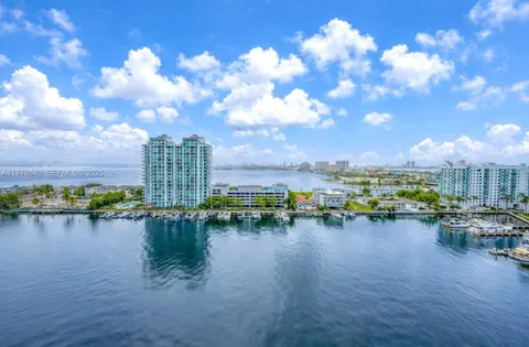 a view of a lake with tall building