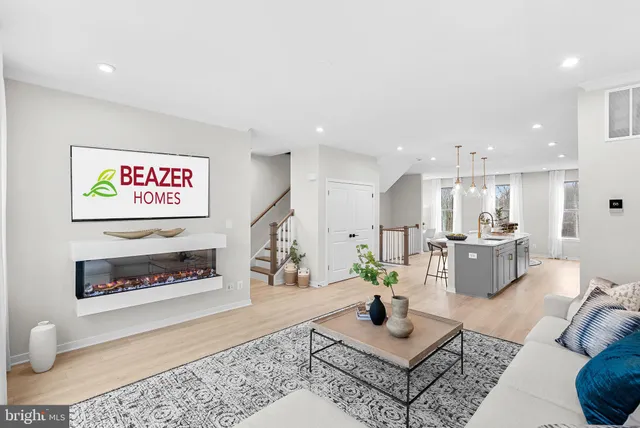 a living room with furniture a flat screen tv and a large window