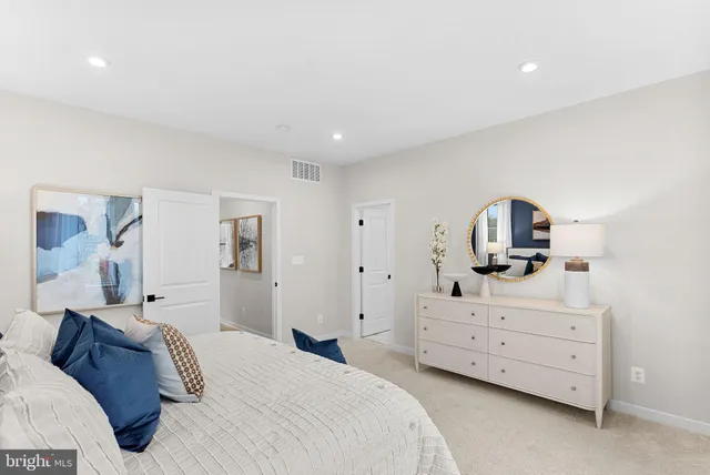 a bathroom with a toilet sink and shower
