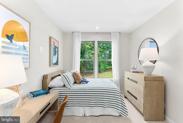 a view of a livingroom with an empty space and a window