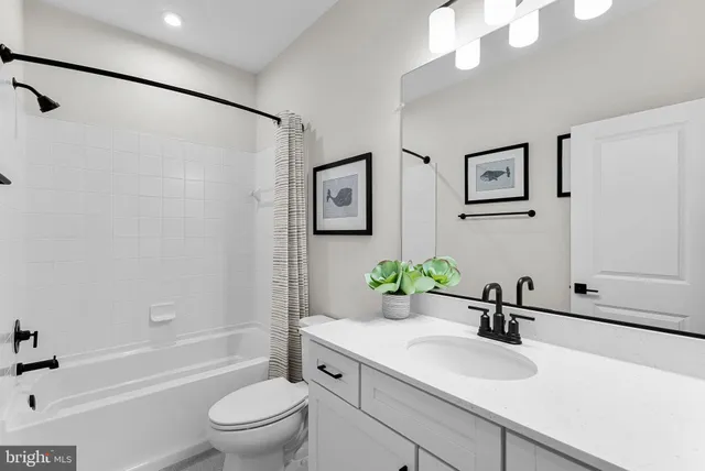 a bedroom with furniture and window